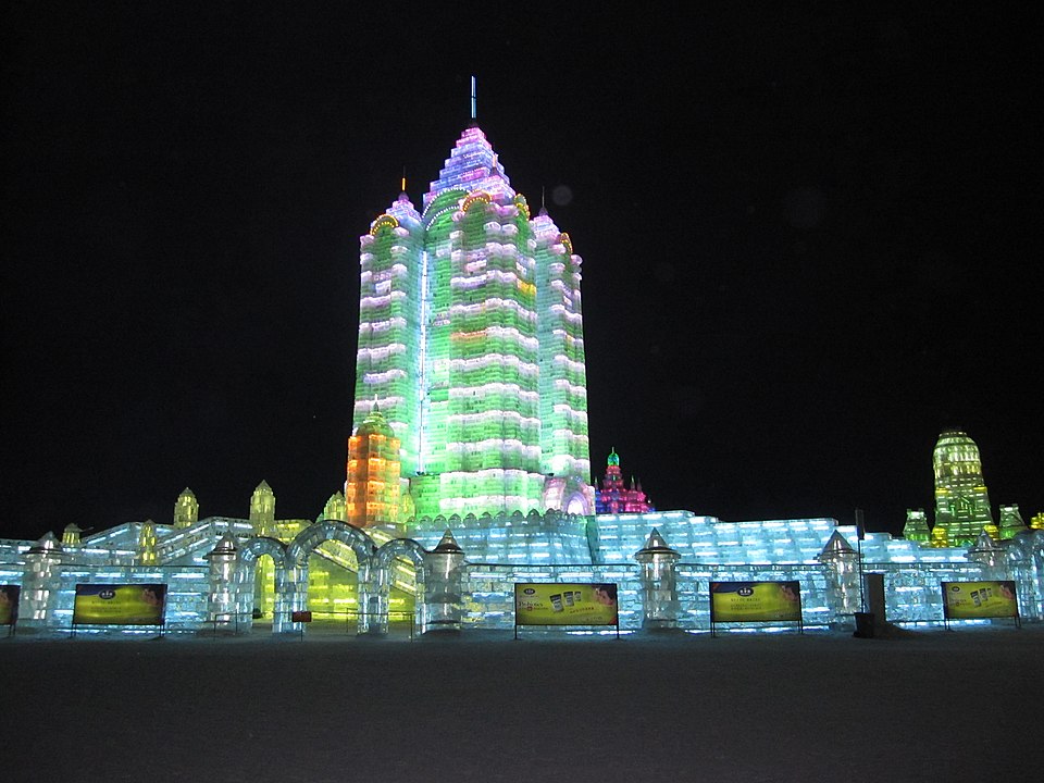 An illuminated tower made of ice blocks